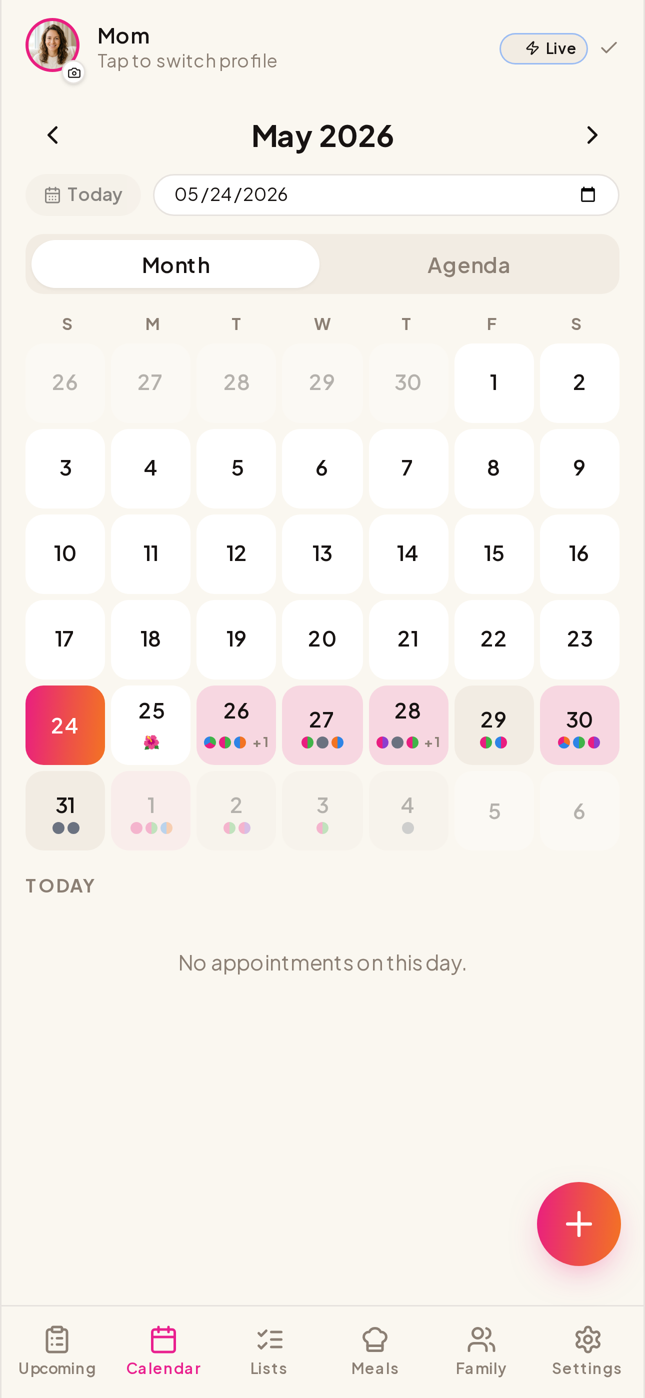 Our Life calendar grid with color-tinted appointment dots